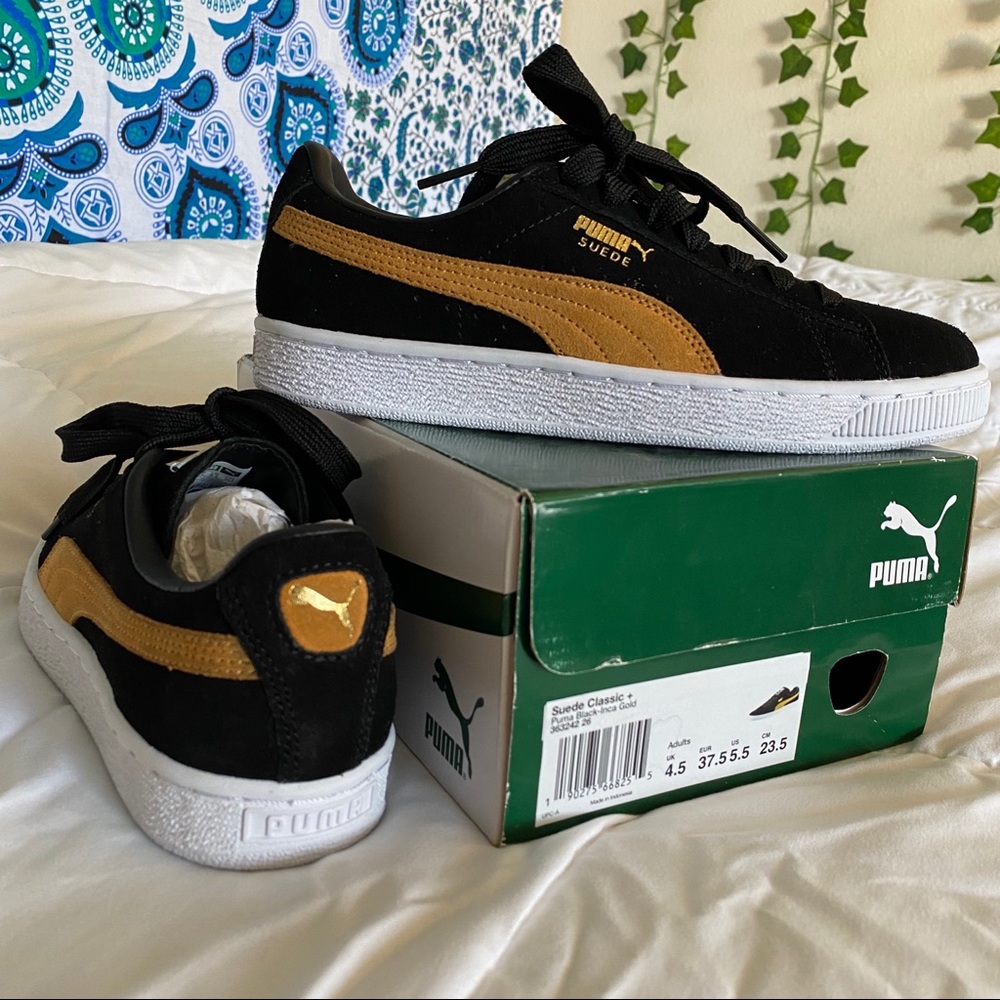Black suede classic pumas
